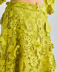 Elegant green lace set with flared sleeves and scalloped details