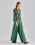 High-rise Gia Pants in green offering comfort and sophisticated style