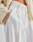 Refined wide-leg pants in ivory offering modern elegance and timeless charm