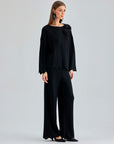 Sophisticated Annais Knit Set in black with unique top design featuring zigzag patterns and floral embellishments