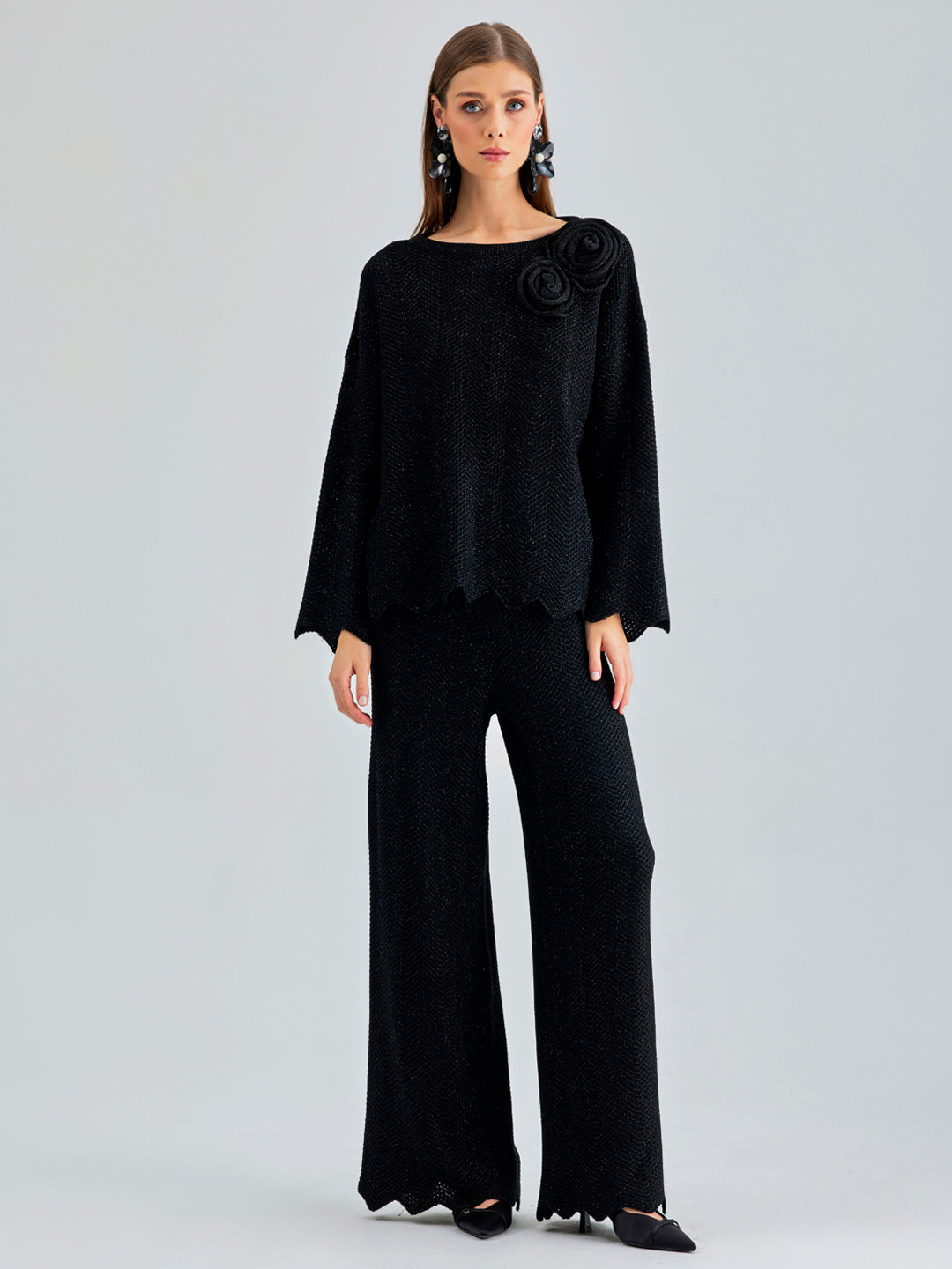 Annais Knit Set in sleek black with long-sleeve top featuring zigzag patterns and floral shoulder embellishments