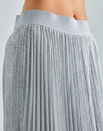 Dazzling Aria Skirt in Silver, featuring a midi length and dynamic pleated texture