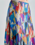 Cora Skirt with bold geometric patterns in cool blues and purples, showcasing a dynamic visual impact