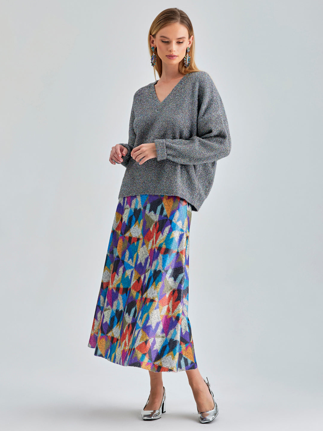 Eye-catching Cora Skirt featuring vibrant geometric designs and a subtle sheen for contemporary appeal