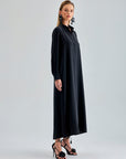 Sleek black silk dress draping beautifully for formal events