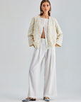 Chic ivory jacket with exquisite floral embroidery and wrist-length sleeves