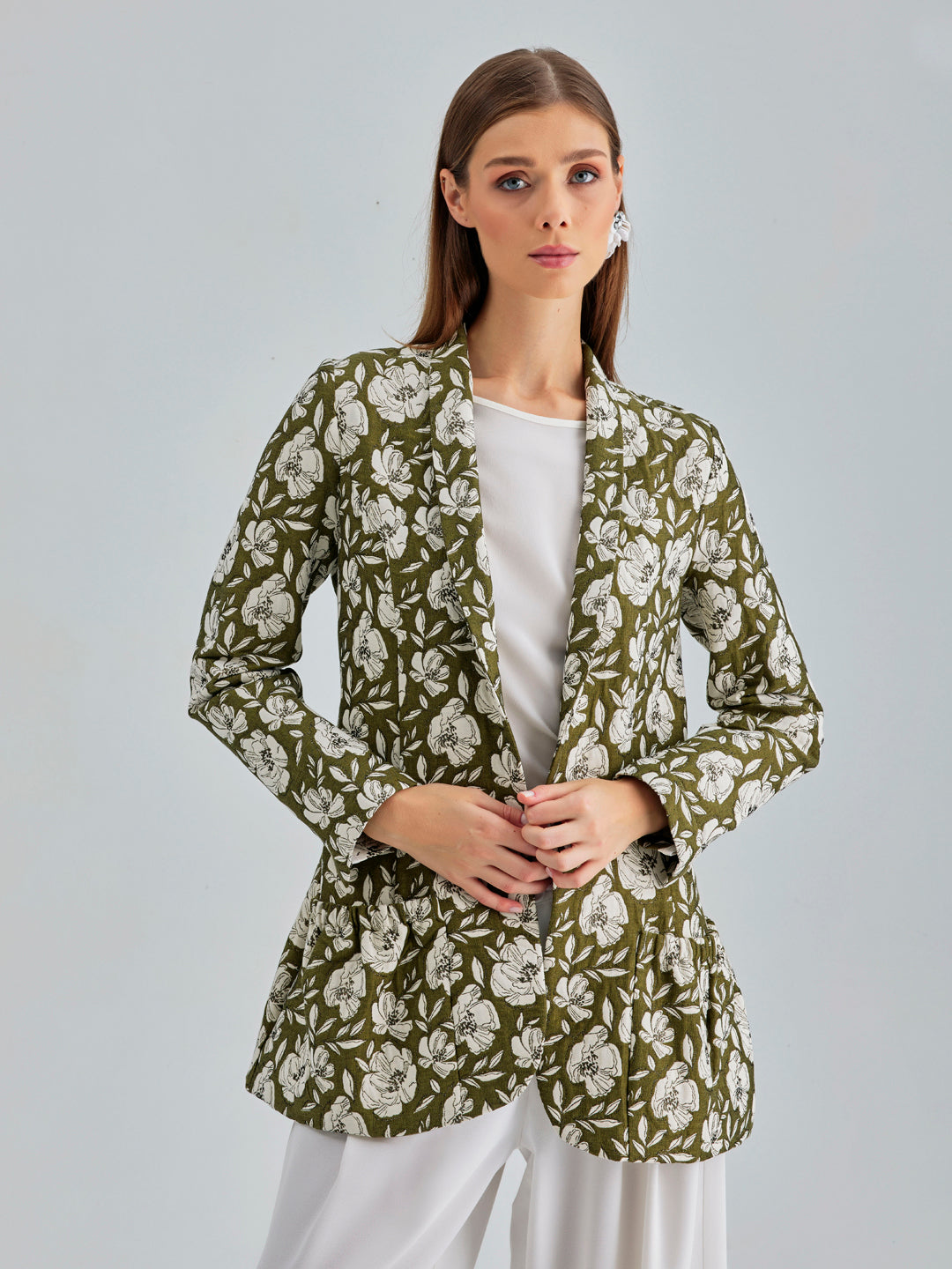 Sophisticated khaki jacket featuring refined white floral details