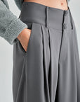 Elegant grey trousers featuring button-fastened waistband and wide-leg design