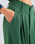 Elegant green trousers featuring button-fastened waistband and flowing wide-leg design