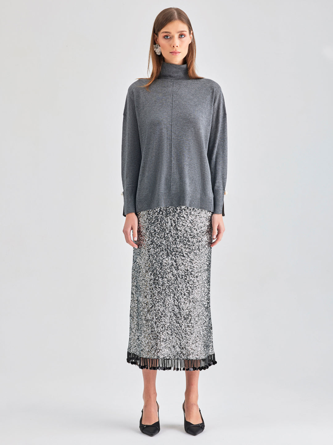 Lana Knit Top Grey with a plush turtleneck and elegant pearl details, perfect for both professional and casual settings