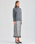 Timeless Lana Knit Top in grey featuring a warm turtleneck and refined pearl embellishments on the cuffs