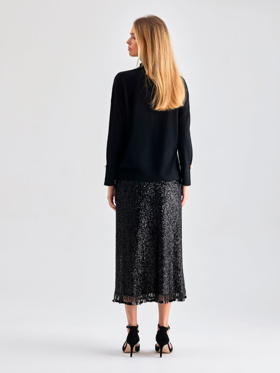 Midi-length Lupita Skirt Black featuring a polished silhouette and fringe accents