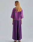 Flowy Gia Pants Violet featuring a high-rise fit and wide-leg cut for standout style