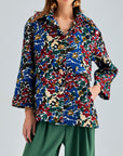 Colorful Tess Jacket featuring an open V-neckline and short sleeves