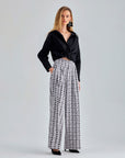 Sophisticated grey wide-leg pants with a functional front pocket and luxurious fabric