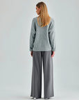 Modern grey trousers with button-fastened waist and versatile styling options