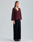 Sophisticated Ernesta Sweater Bordeaux with bold design elements and striking sleeve cut-outs