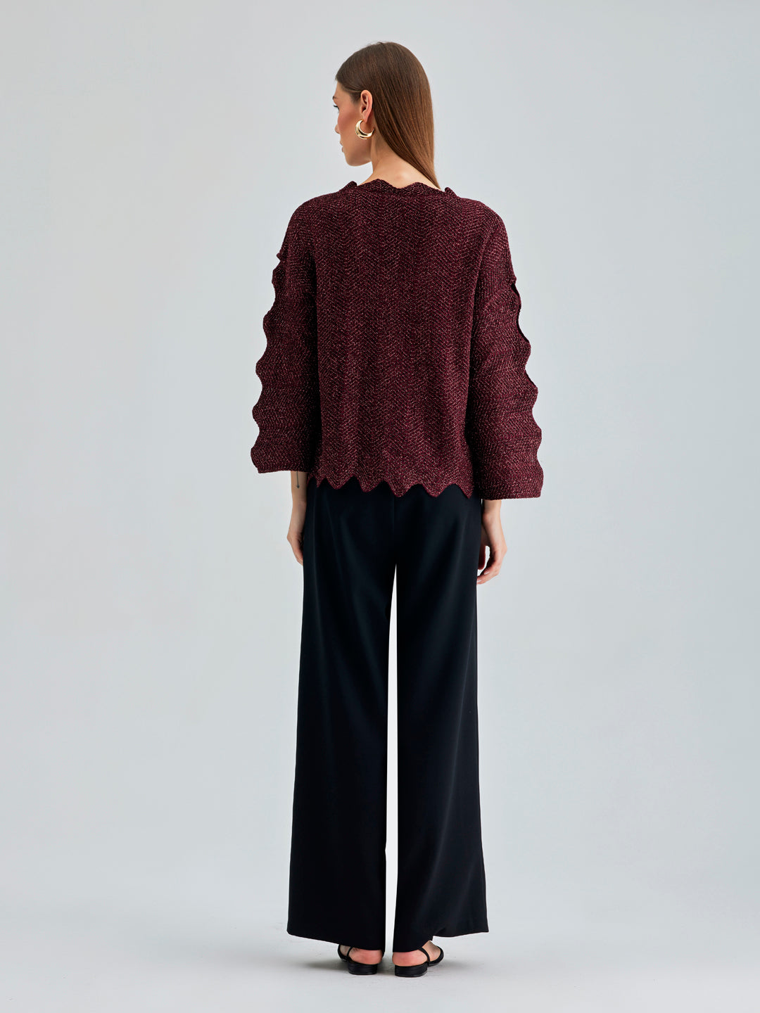 Fashion-forward Ernesta Sweater Bordeaux featuring bold sleeve details and innovative architectural collar