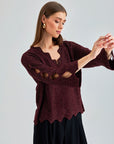 Elegant Ernesta Sweater in deep red featuring unique cut-out details and architectural ladder collar