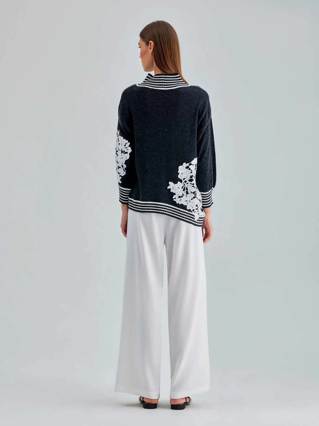 Timeless Leti Sweater featuring soft fabric and intricate white floral details for a modern, feminine appeal