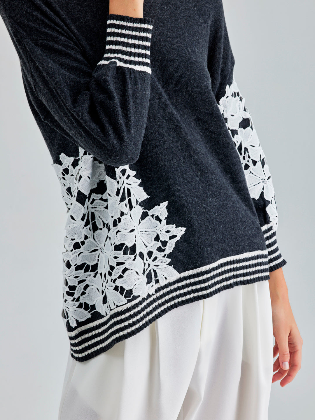 Romantic Leti Sweater with long sleeves and floral accents, perfect for adding a touch of charm to any outfit