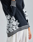 Romantic Leti Sweater with long sleeves and floral accents, perfect for adding a touch of charm to any outfit