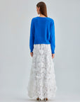 Daisy Cardigan Blue with a soft, draping fabric and delicate embroidery, enhancing any outfit with understated charm