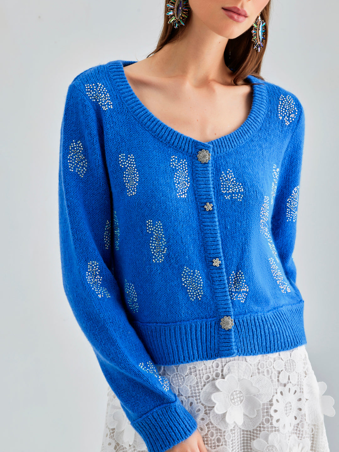 Daisy Cardigan Blue with a serene hue and delicate embroidery, offering a blend of comfort and classic style