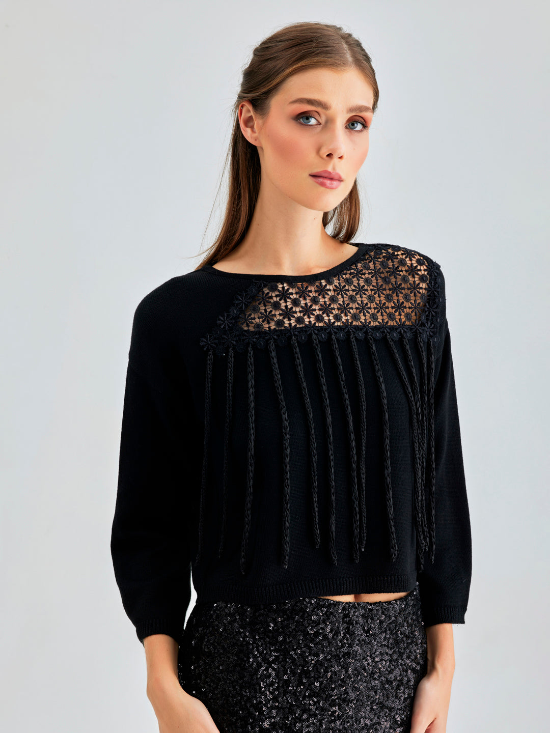 Sophisticated Belem Sweater with long sleeves and a dramatic diagonal transparent panel combined with playful fringe