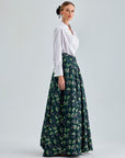 Enda Taffeta Skirt in green multicolor with practical pockets and graceful pleats