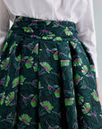 Enda Taffeta Skirt in green multicolor with practical pockets and a high-waisted, pleated design