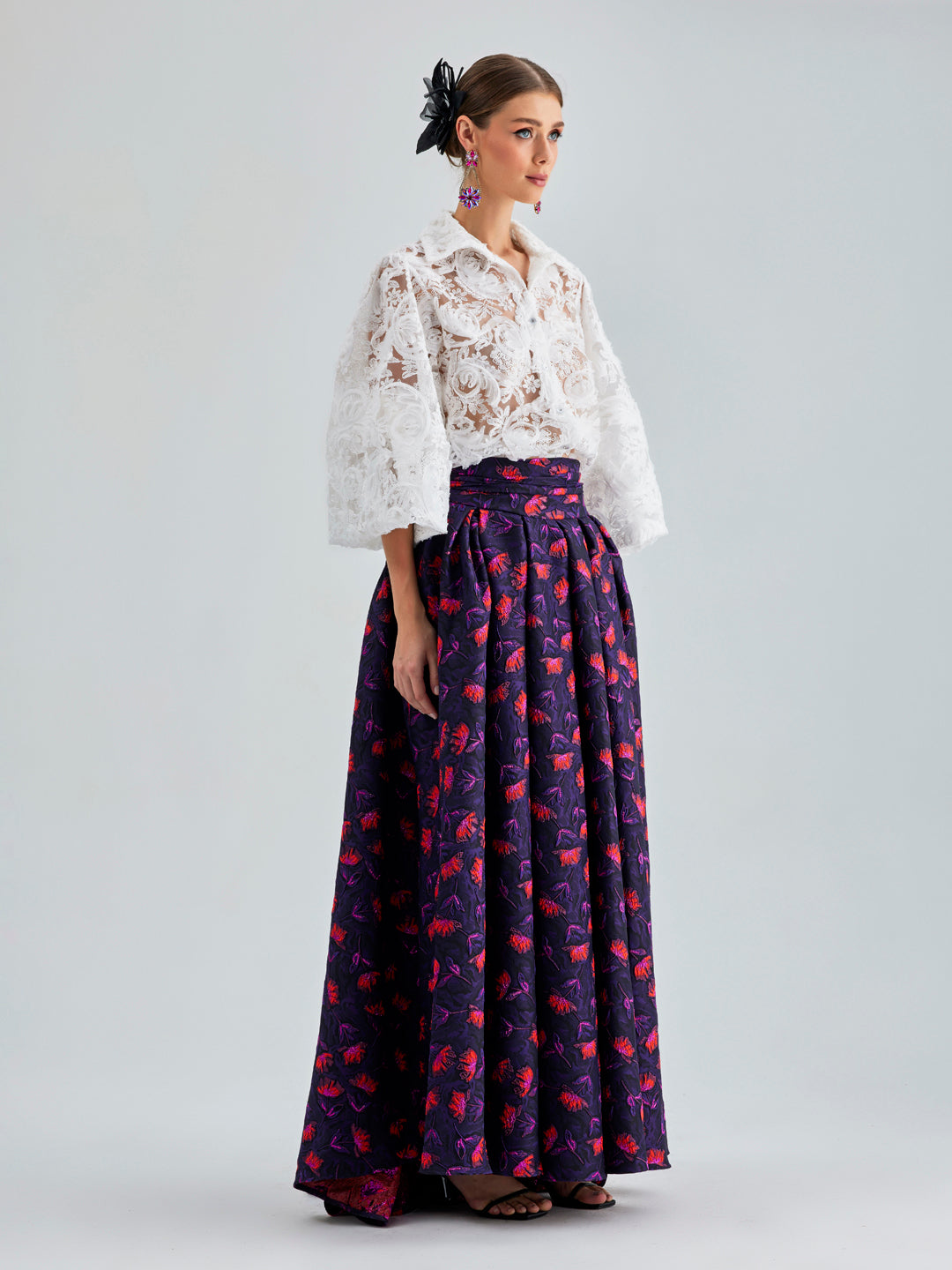 Faina Skirt Violet with colorful floral patterns and a voluminous, circular cut, ideal for infusing energy into your wardrobe