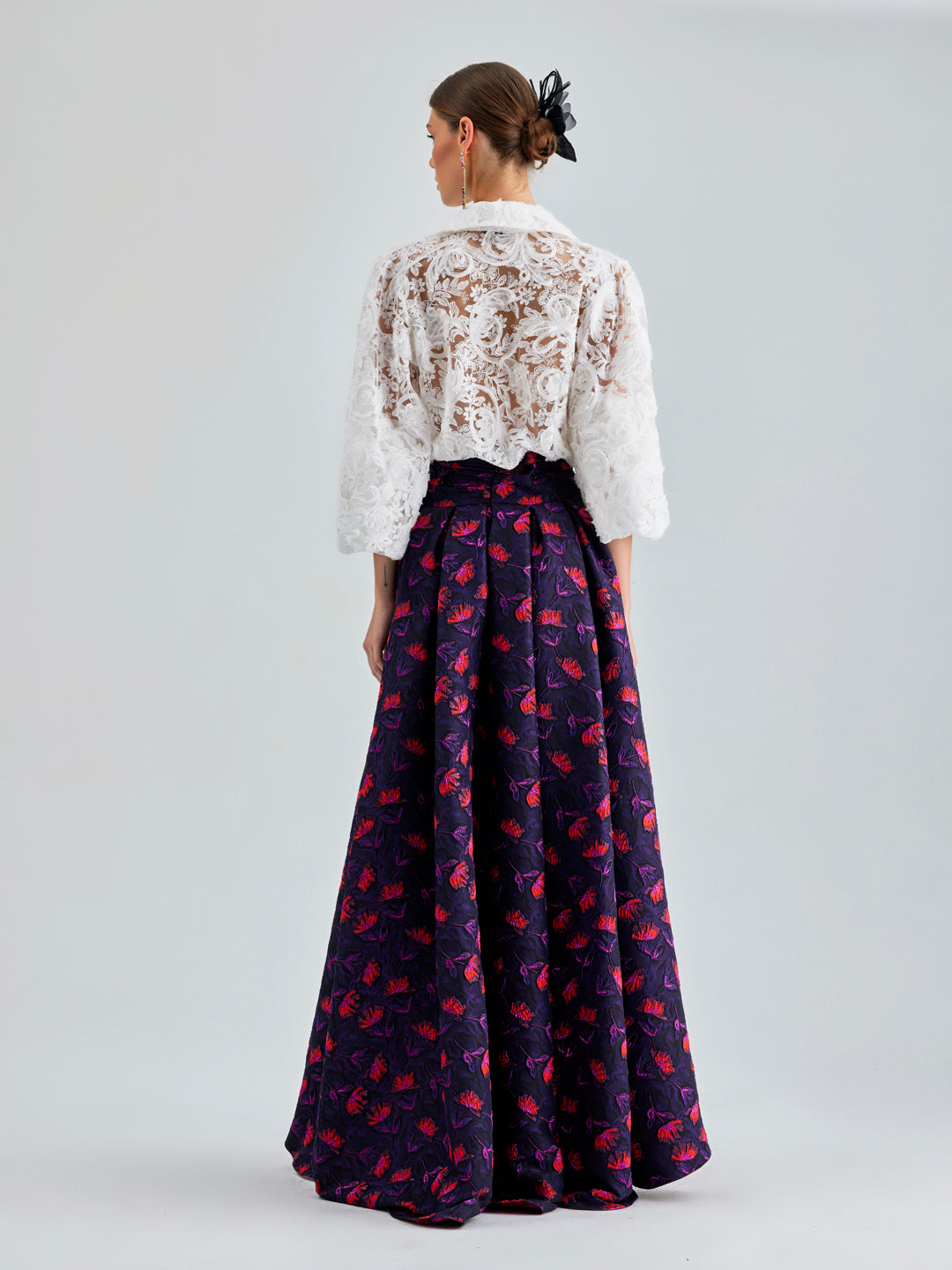 Chic Faina Skirt featuring vivid multicolor floral print and a metallic touch, adding a whimsical flair to your look