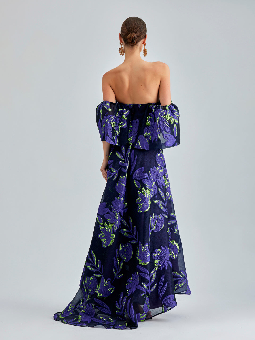 Zelene Gown Violet adorned with luxurious floral patterns and an open back for a sophisticated look