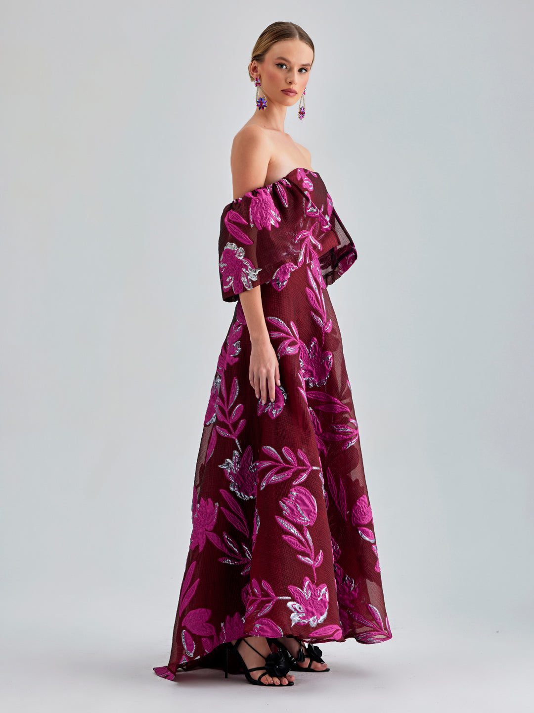 Zelene Gown Red with seductive open back and bold floral patterns, ideal for high-profile events