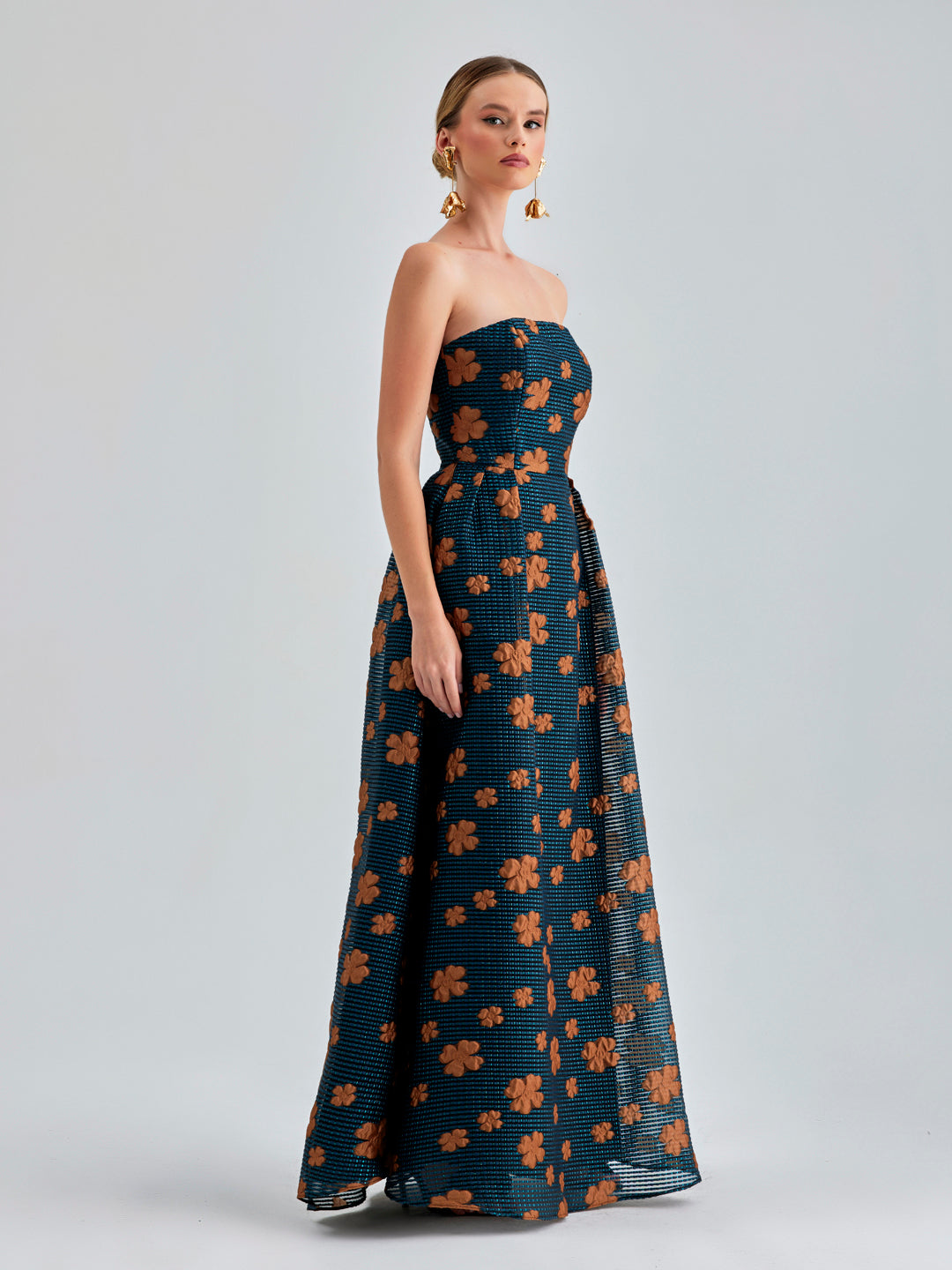 Off-shoulder Sierra Gown Strapless with vibrant paisley prints and flowing maxi skirt