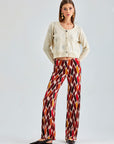 Dynamic Pepe Pants featuring a lively mix of colors and retro-inspired check patterns