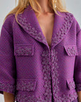 Elegant violet jacket with breezy open neckline and floral accents