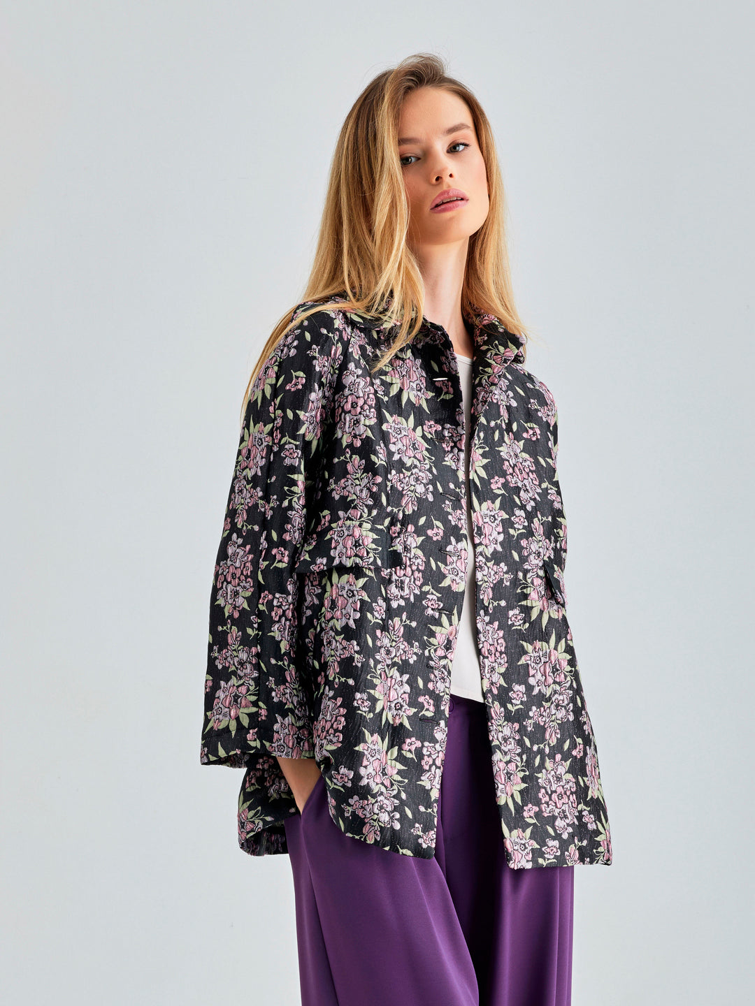 Bold Tess Jacket with playful floral details and modern V-neckline