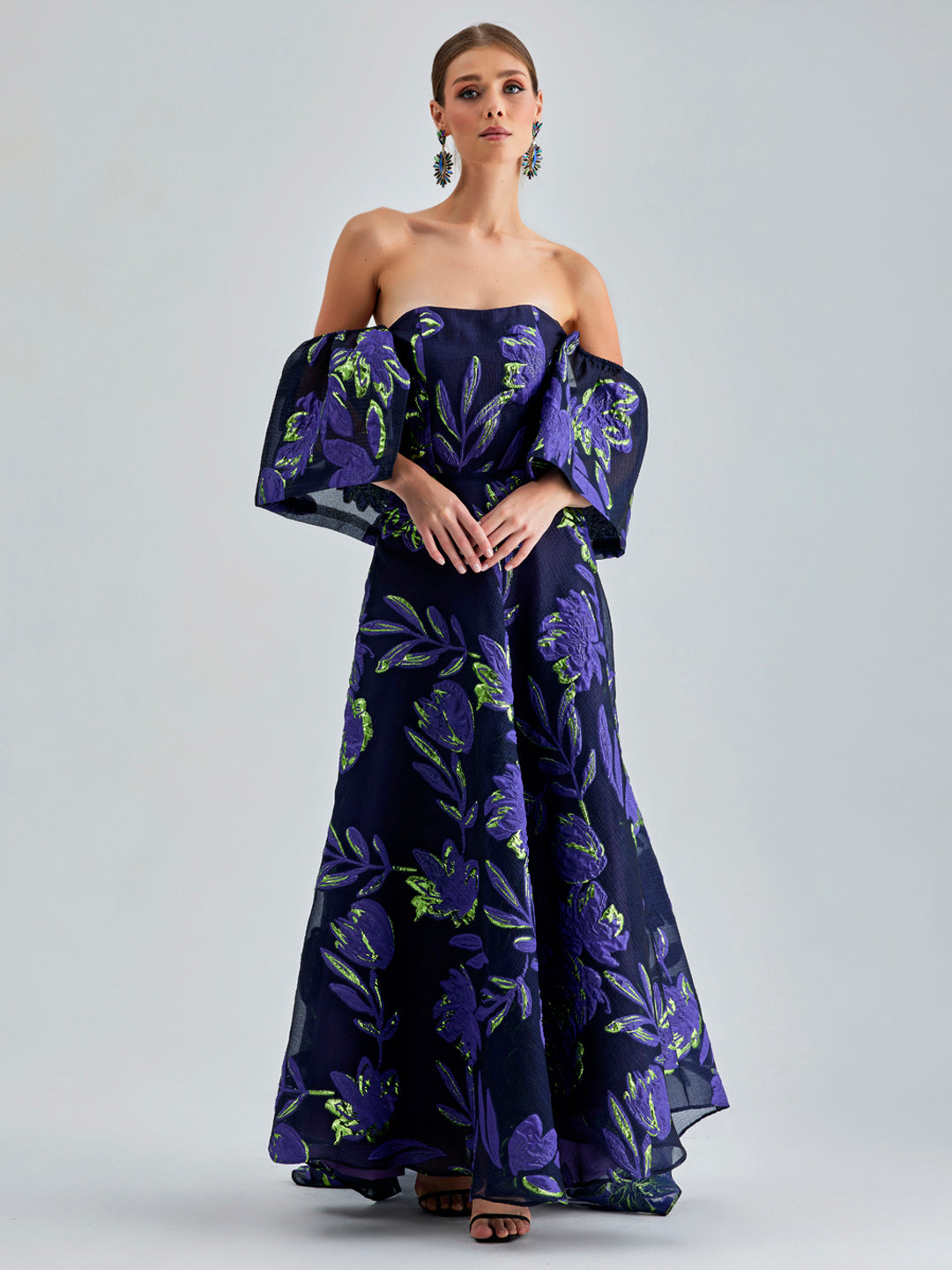 Zelene Gown Violet with large-scale floral patterns and a rich violet hue, featuring a daring open back