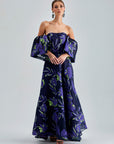 Zelene Gown Violet with large-scale floral patterns and a rich violet hue, featuring a daring open back